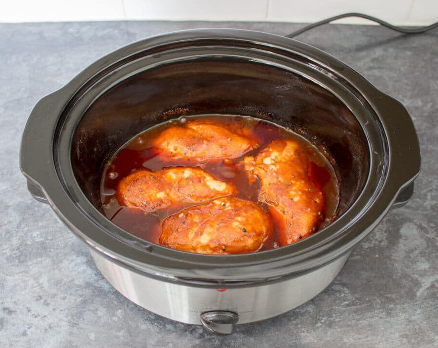 step 4 Pop the lid on and cook on high for 3 – 3.5 hours, until the chicken is cooked through.