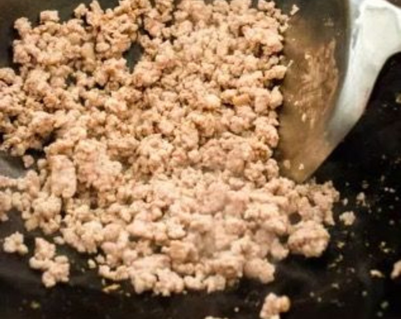 step 2 Heat 2 tablespoons of Cooking Oil (2 Tbsp) in a wok over medium-high heat. Add Ground Pork (8 oz), and stir-fry until the pork is fully cooked. Remove the ground pork from the wok and set aside.