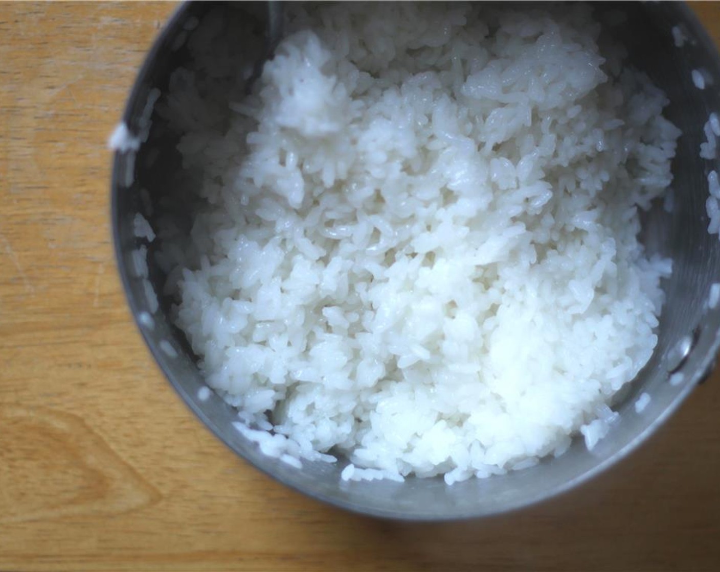 step 7 When the rice has cooled a bit, dissolve the Granulated Sugar (1 Tbsp) and Salt (1/2 tsp) in the Rice Vinegar (2 Tbsp) and add the solution to the rice. Fluff with a fork until the rice is evenly coated.