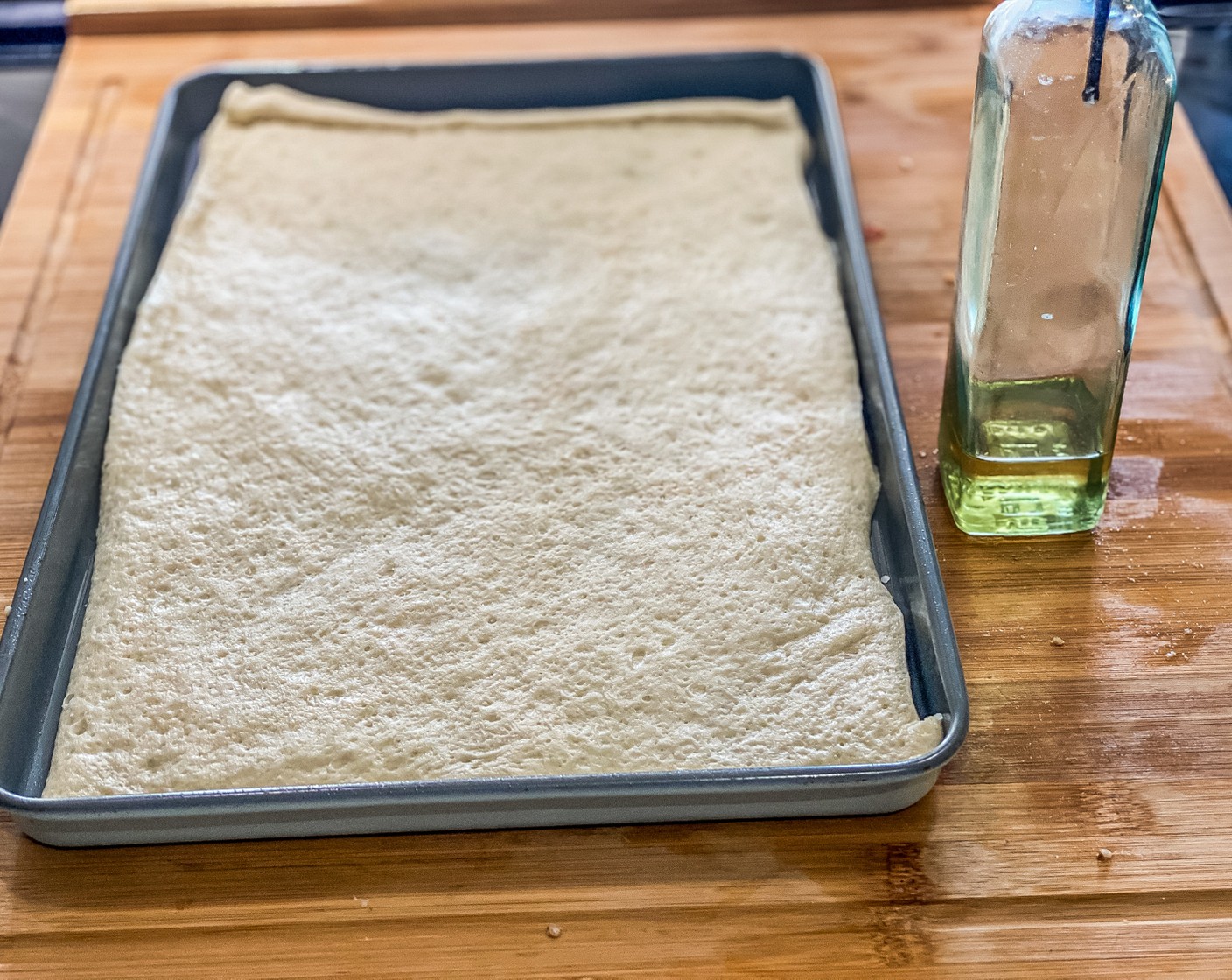 step 1 Preheat the oven to 400 degrees F (205 degrees C). Spray the baking sheet with Non-Stick Baking Spray (as needed). Add Prepared Pizza Crust (1 can) and shape to fit the baking sheet.