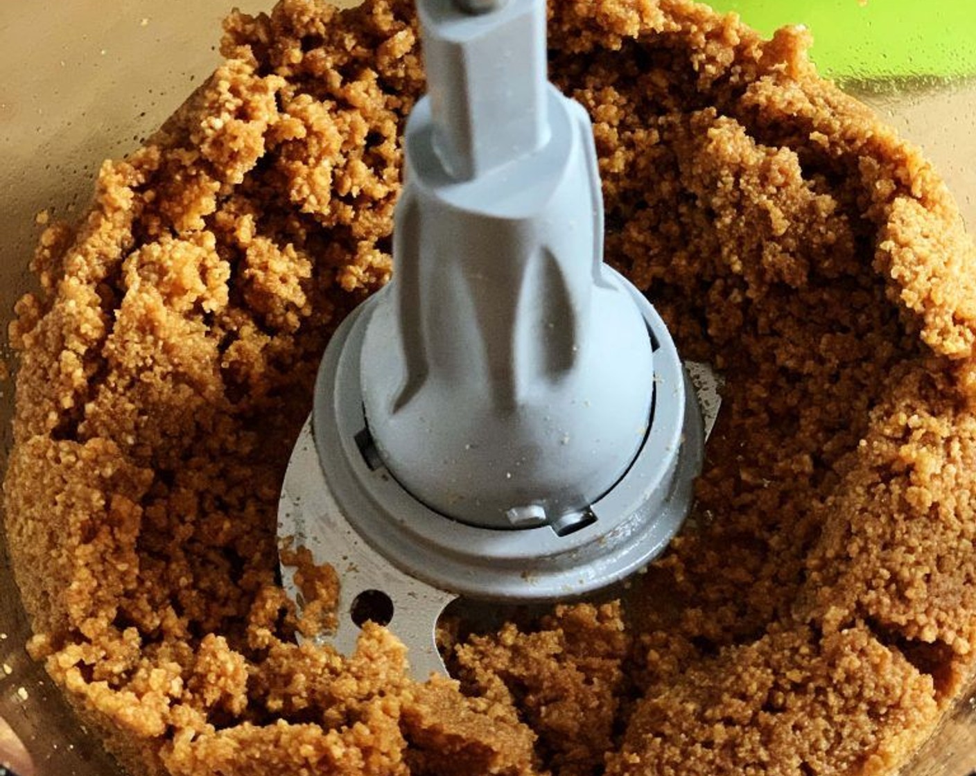 step 2 With your food processor running, slowly pour in the Unsalted Butter (1/3 cup) and pulse until the mixture comes together.