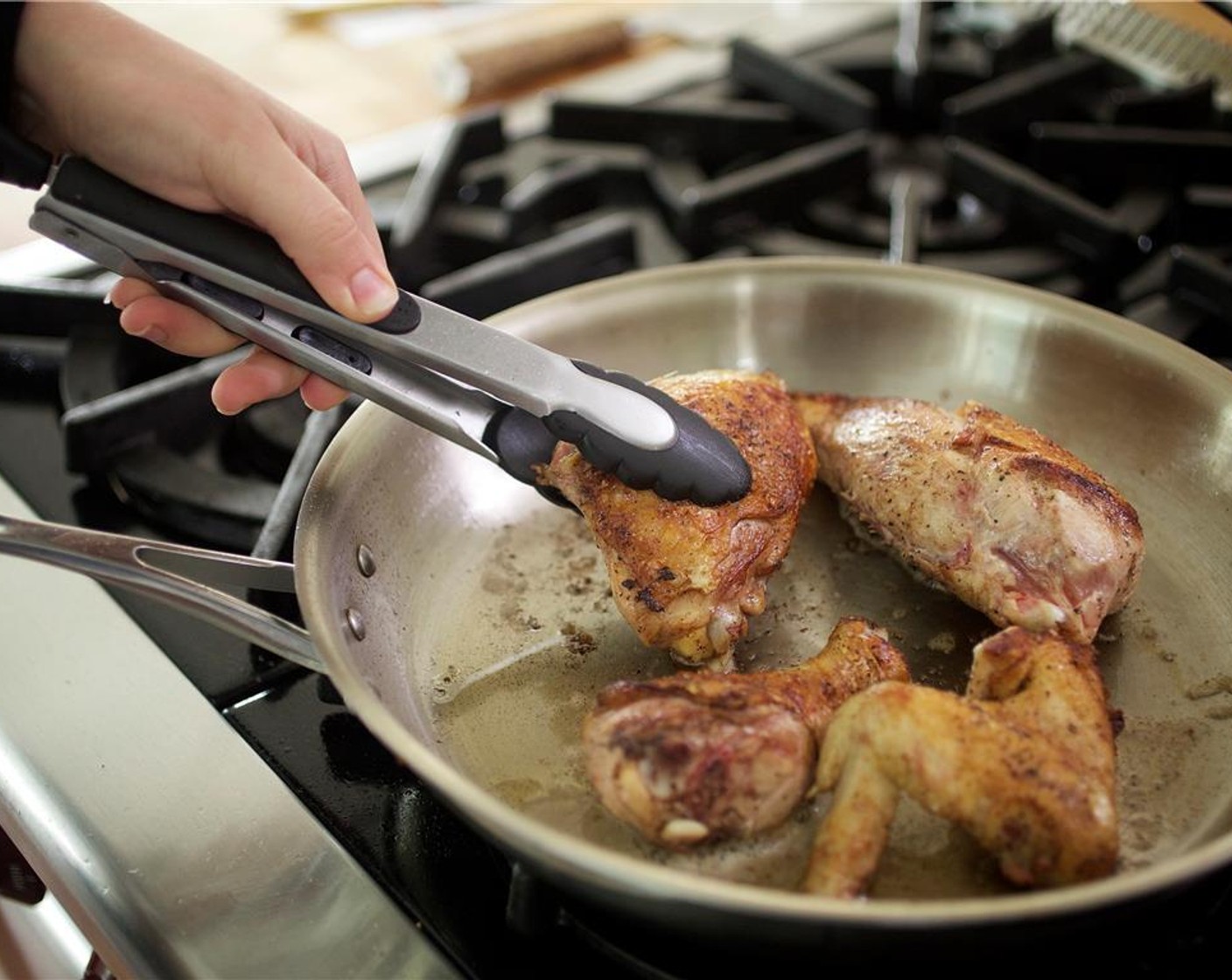 step 10 Add the chicken and minced shallots to the pan and reduce the heat to medium-low. Simmer for 6 to 7 minutes.