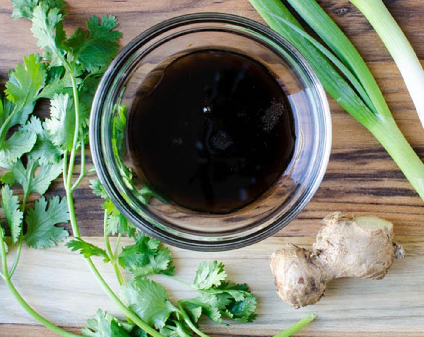 step 3 For the Asian Sauce, in a small bowl, add Low-Sodium Soy Sauce (1 1/2 Tbsp), Rice Vinegar (1 Tbsp), Sesame Oil (1 Tbsp), Fresh Ginger (1/2 Tbsp), Lime (1), Caster Sugar (1 tsp), Fresh Cilantro (1 Tbsp), and Scallion (1 bunch).