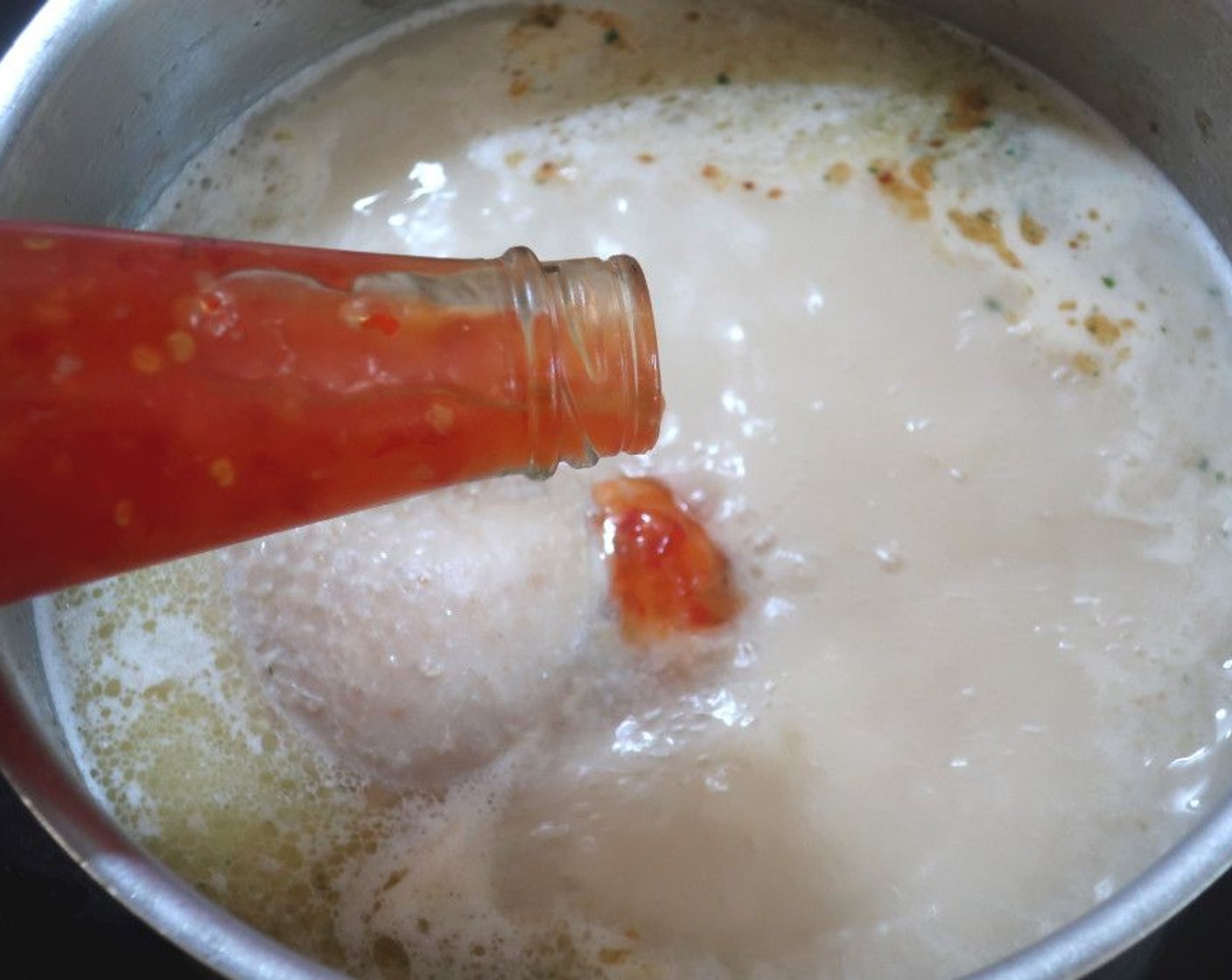 step 2 about halfway through the cooking process, 20 to 30 minutes, add Coconut Milk (1 can) and Thai Sweet Chili Sauce (2 Tbsp) to the soup.