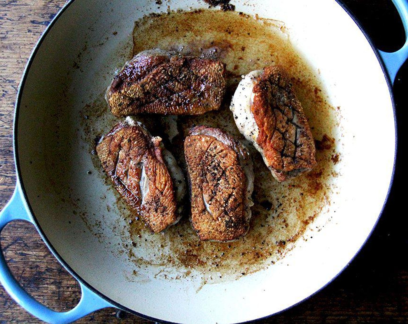 step 6 Spoon off and reserve the fat from the skillet. Flip over the breasts and transfer the skillet to the oven. If you place pan in oven, roast for 2 to 4 minutes or until an instant-read thermometer inserted into the thickest part of the breast registers 125-135 degrees F (51-57 degrees C). Transfer breasts to a plate to rest.