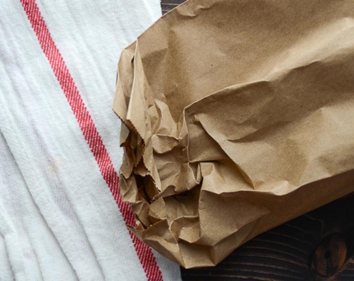 step 2 Remove from the oven and slip into a small paper bag. Roll up the end of the bag and let the pepper steam.