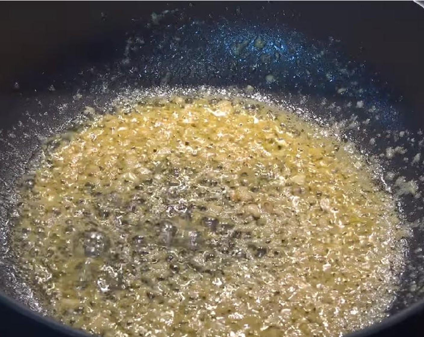 step 3 Rinse and dry the pan, then put it on medium heat. Add Butter (2 Tbsp). Once it is melted, add Garlic (3 cloves), and stir until the garlic becomes aromatic.