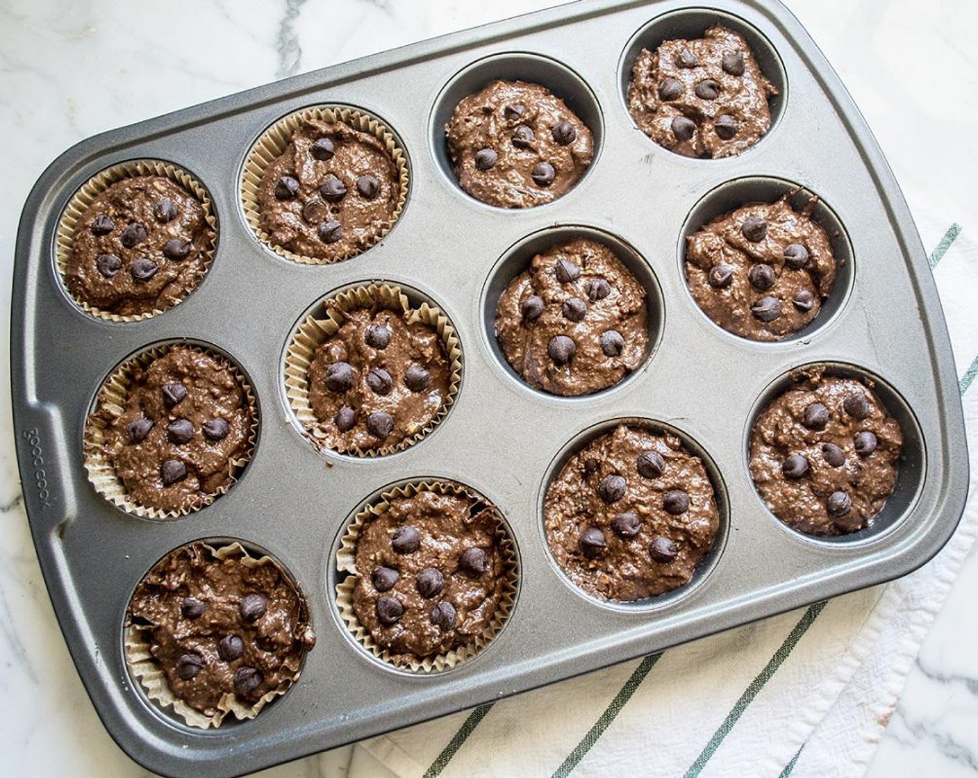 step 6 Stir in Semi-Sweet Chocolate Chips (1/2 cup), then divide equally into 12 muffins, top with remaining Semi-Sweet Chocolate Chips (2 Tbsp).