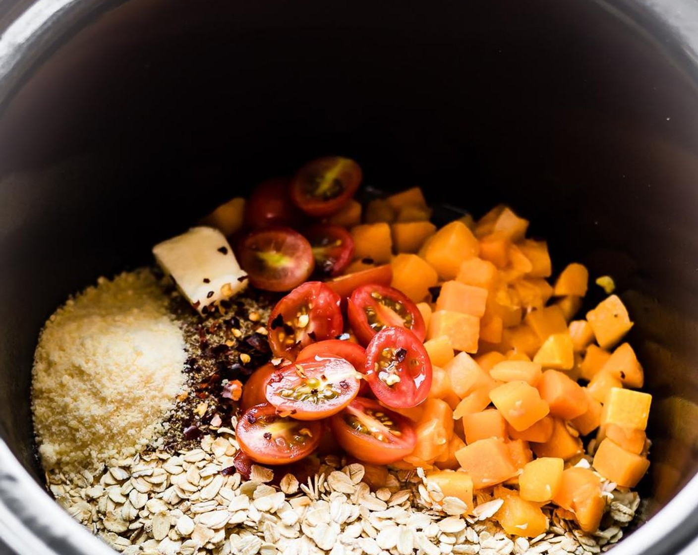 step 1 Place the Gluten-Free Rolled Oats (1 1/4 cups), Butternut Squash (1 cup), Cherry Tomato (1/2 cup), Flaxseeds (2 Tbsp), Butter (1 Tbsp), Garlic (1 tsp), Sea Salt (1 tsp), Freshly Ground Black Pepper (1 pinch), Crushed Red Pepper Flakes (1 tsp), Unsweetened Almond Milk (2 cups), Vegetable Broth (3/4 cup) and Parmesan Cheese (4 Tbsp) in the slow cooker. Mix all together and set on high 3 hours or low for 5.