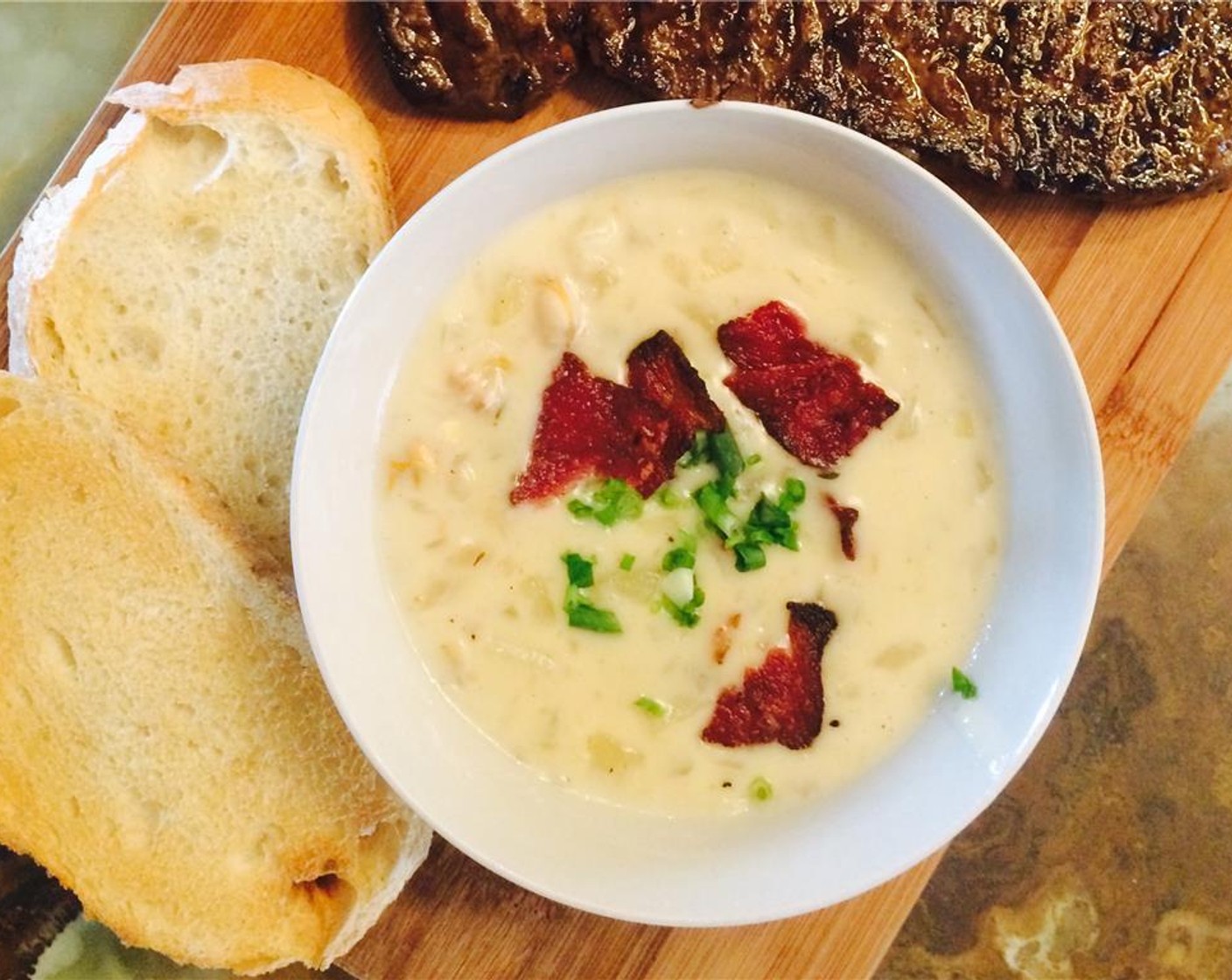 step 13 Serve with toasted sourdough bread, bacon on top, and chopped green onion. Enjoy!