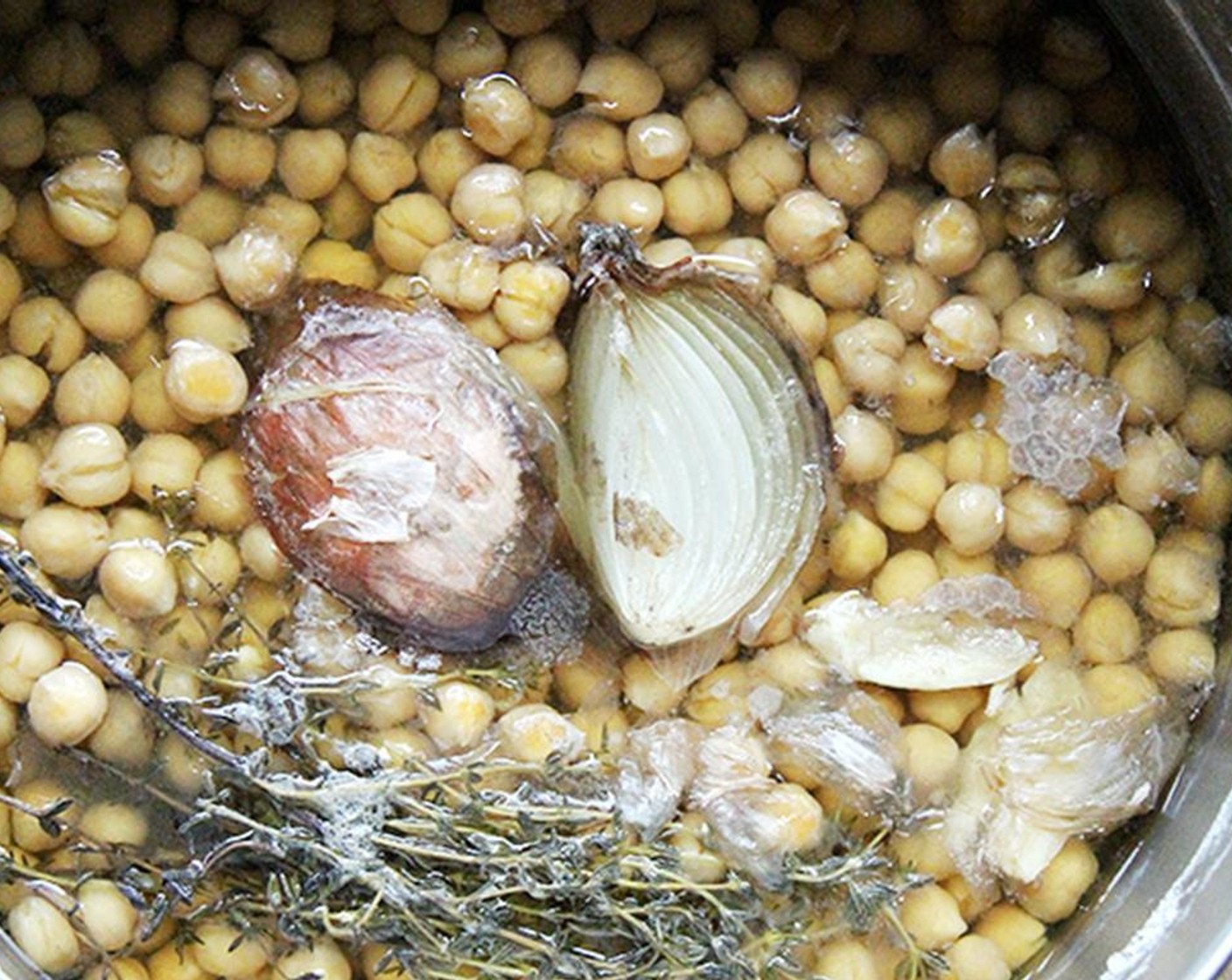 step 2 Drain and place in a pot with Onion (1), Fresh Thyme (1 sprig), Garlic (1 clove), Bay Leaf (1) and more salt.