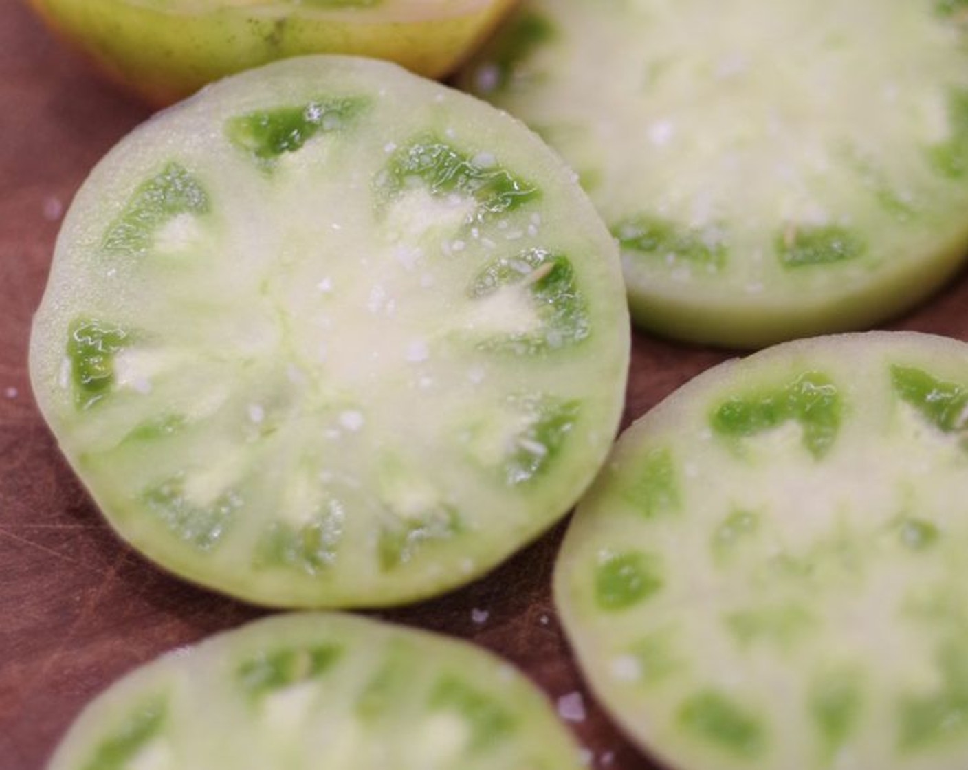 step 1 Slice Green Tomatoes (3) in 1/2-inch slices and slightly Kosher Salt (1 Tbsp) on both sides.  Let them rest on paper towels to draw out the excess water.