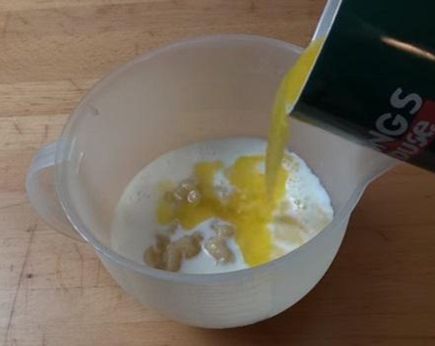 step 3 In a separate jug, add the Bananas (2), Milk (1/2 cup), Butter (5.5 oz) and Eggland's Best Classic Eggs (3). Using a spoon, mix everything together.