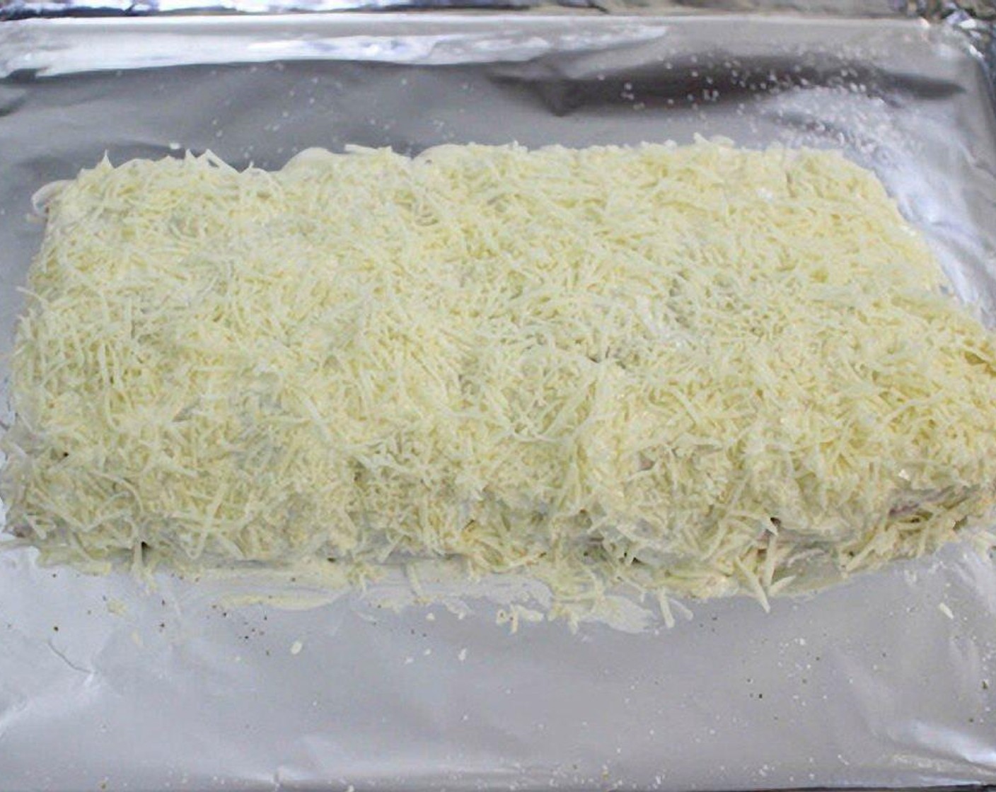 step 6 Top with the Shredded Parmesan Cheese (1/4 cup) and Shredded Mozzarella Cheese (1/3 cup).