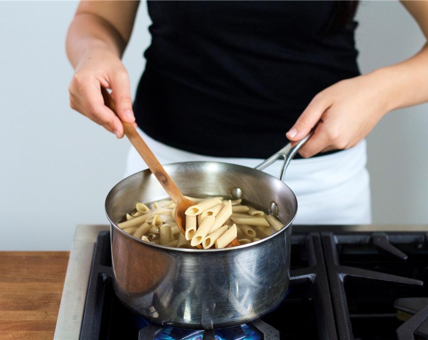 step 5 Once the water has started to boil, add  Whole Grain Penne (1 cup) and stir. Cook for 9 minutes, or until desired texture. Drain the pasta in a colander and reserve a quarter cup of the pasta water, and set aside.