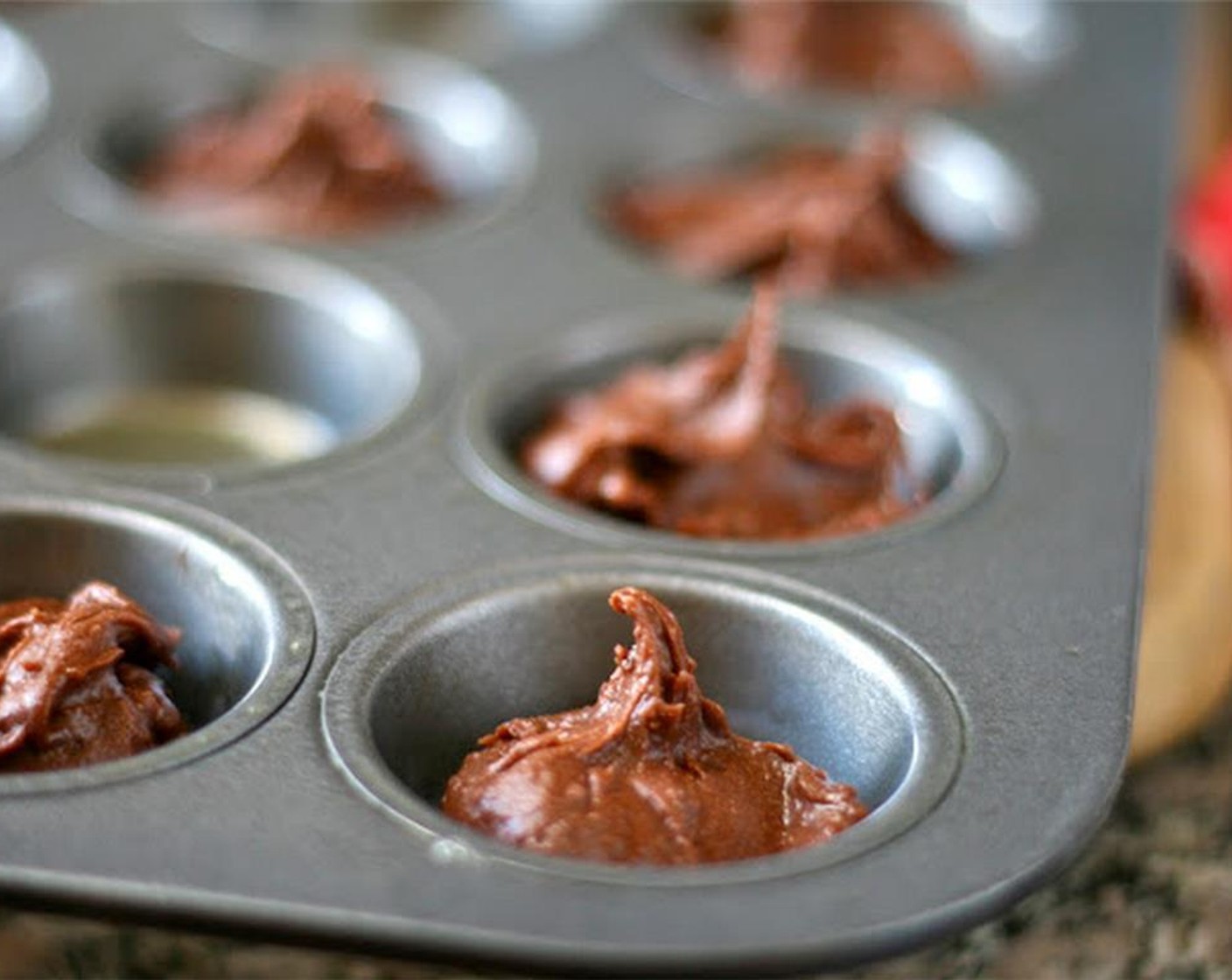 step 2 Drop them into a mini muffin pan lightly greased with cooking spray. Bake for 10-12 minutes.
