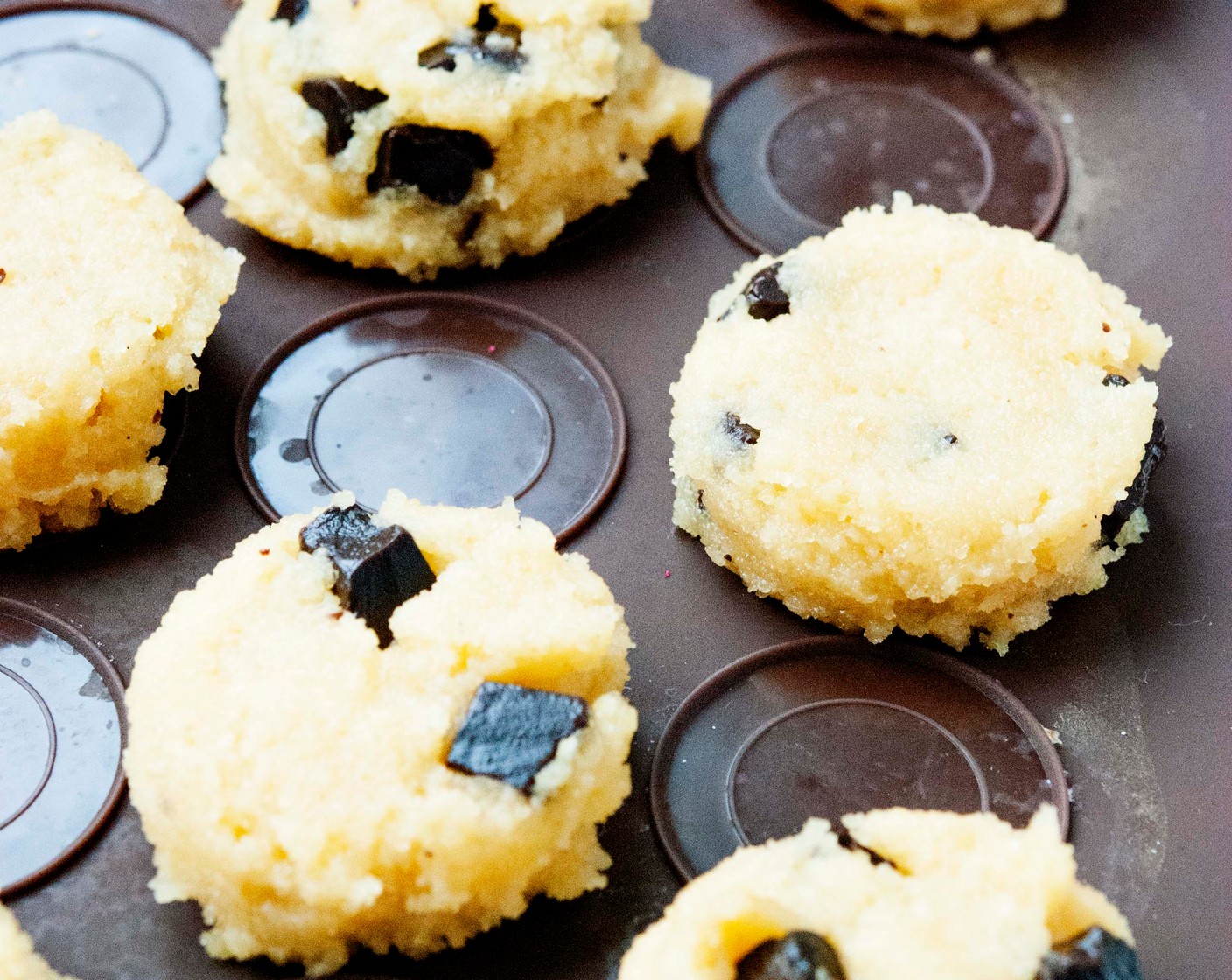 step 4 Once combined, line a baking sheet with parchment paper, and add the cookies using a cookie scoop to the baking sheet.