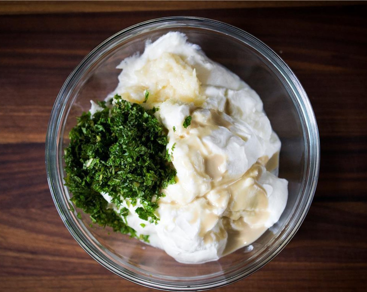 step 4 Add the Tahini (1 tsp) and finely chopped mint to the yogurt.