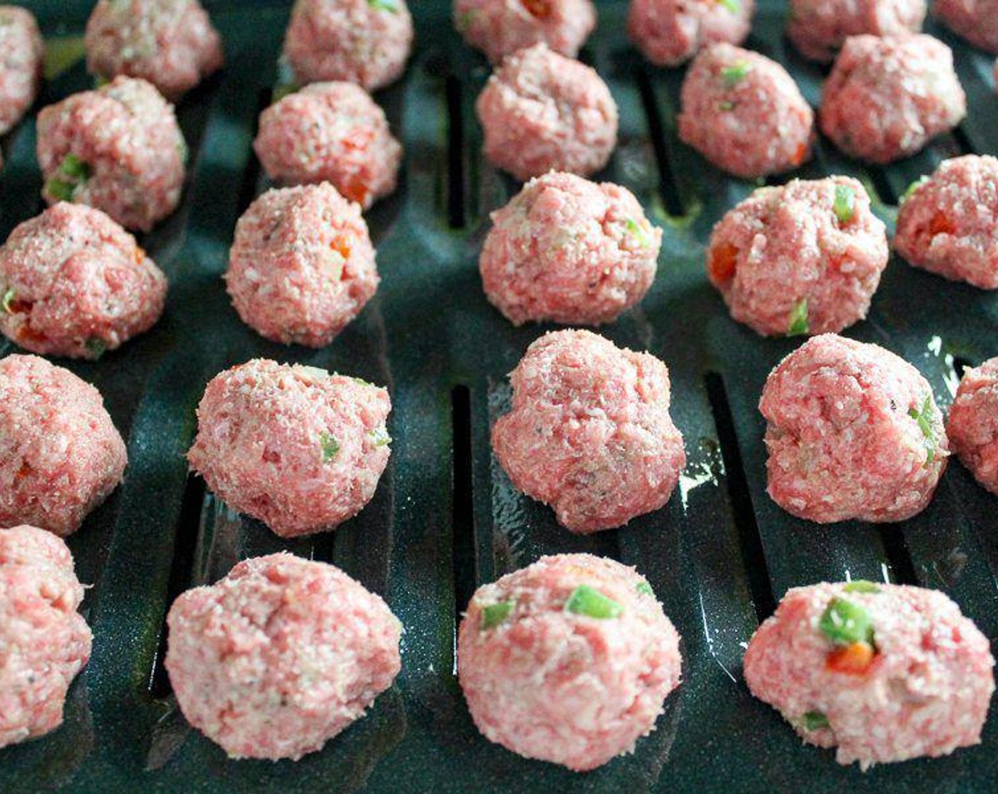 step 4 Using a small spoon or scoop, portion out and roll the meat mixture with your hands into 1-inch or smaller sized balls.