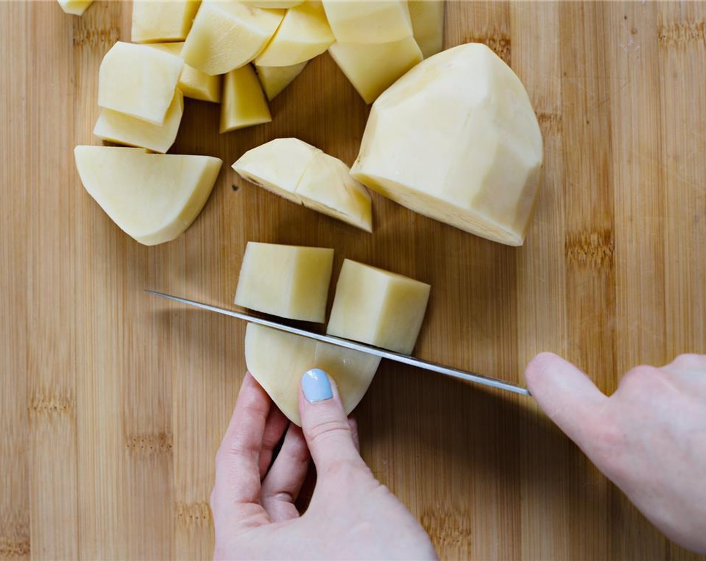 step 3 Chop potatoes into large chunks, about 3 centimeters square.