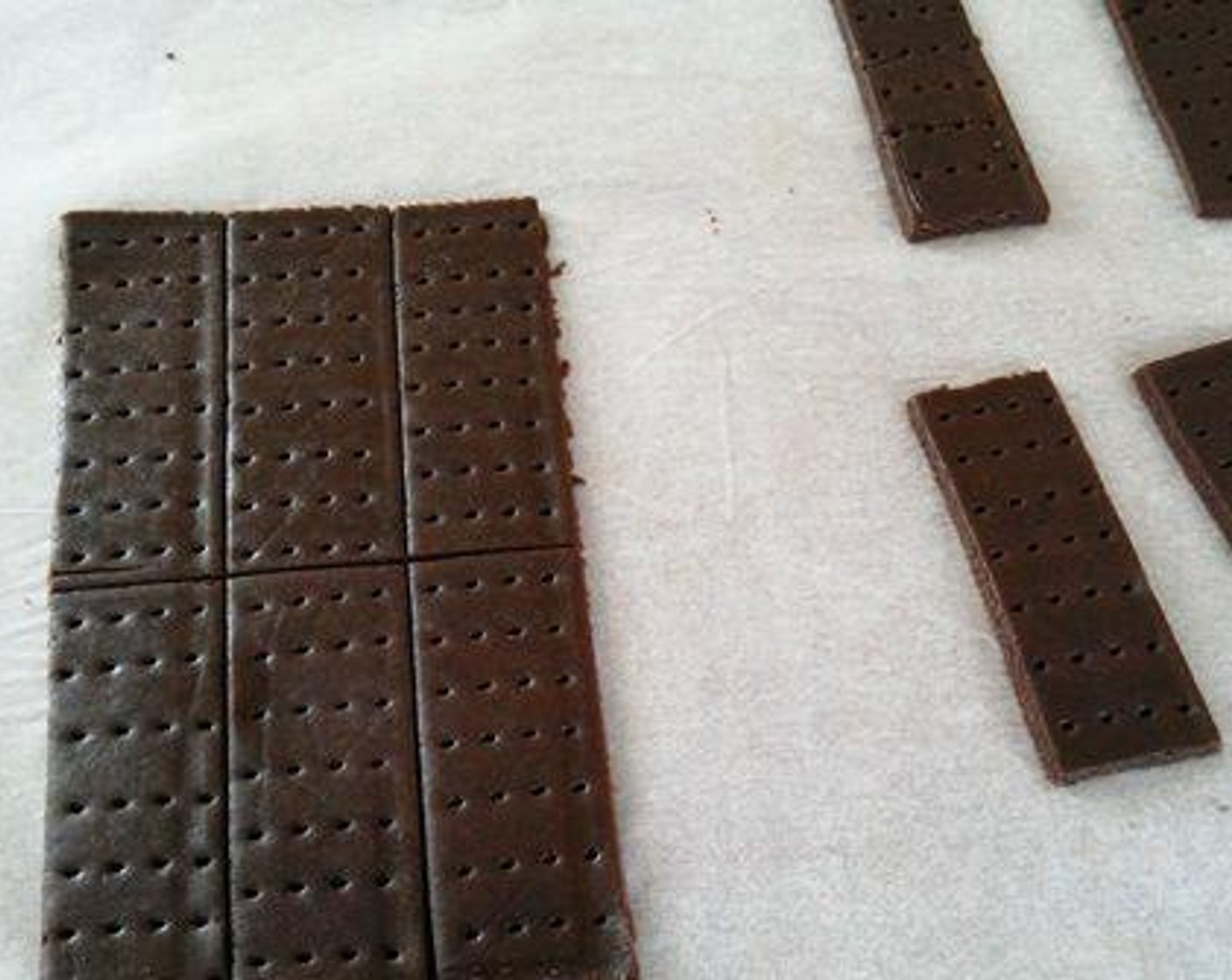 step 6 Using a cookie cutter or knife cut rectangular shaped cookies out of it. Using a fork prick on the rectangle shaped cookie dough. This is done to give it a bourbon biscuit effect. Bake in a preheated oven for 12 to 15 minutes. Once done take it out of the oven and let it cool well.
