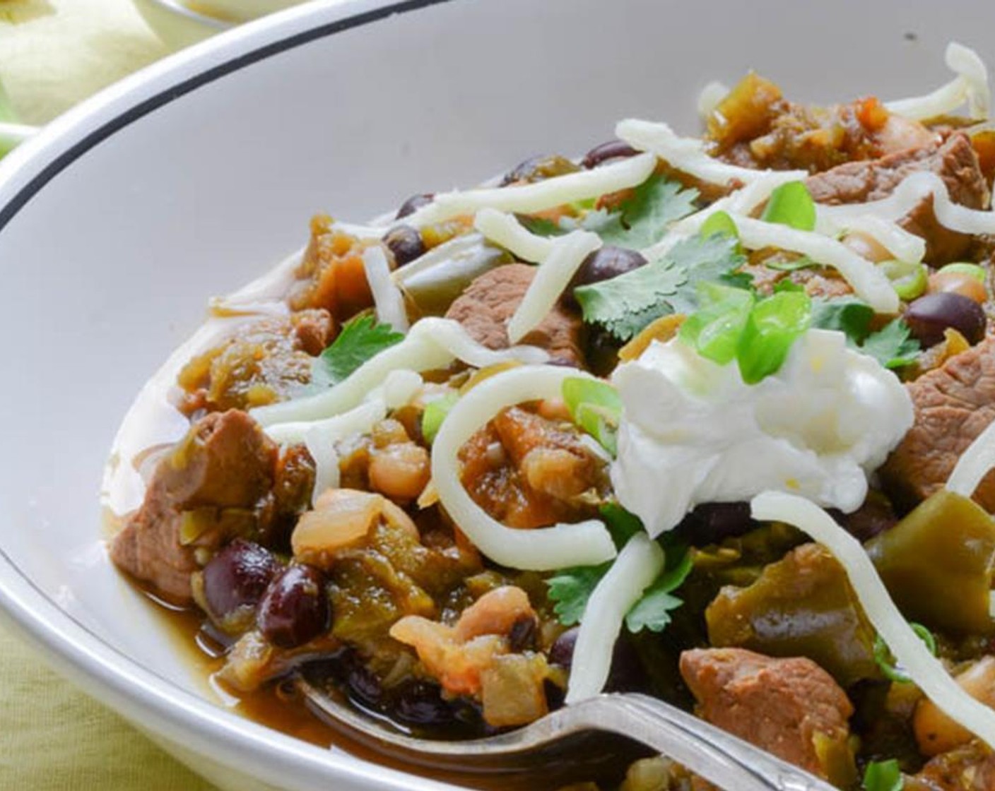 step 10 Serve chili plain or over cooked rice or noodles, with an assortment of  Sour Cream (to taste), diced Scallions (to taste), fresh Fresh Cilantro (to taste) and shredded Monterey Jack Cheese (to taste). Enjoy!