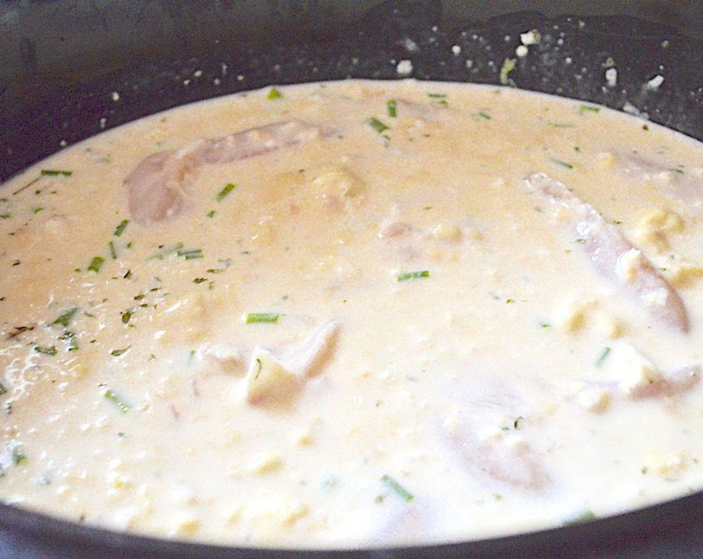step 1 Get out a large slow cooker and combine Chicken Stock (2 cups),Cream of Chicken Soup (2 cans), Heavy Cream (1/3 cup), Fresh Chives (8 stalks), Garlic (2 cloves), Dijon Mustard (1 Tbsp), Dried Parsley (1/2 tsp), Dried Onions (1/2 tsp), Worcestershire Sauce (1/4 tsp), Salt (1 pinch), and Chicken Tenders (2 lb) but the biscuits in its bowl.