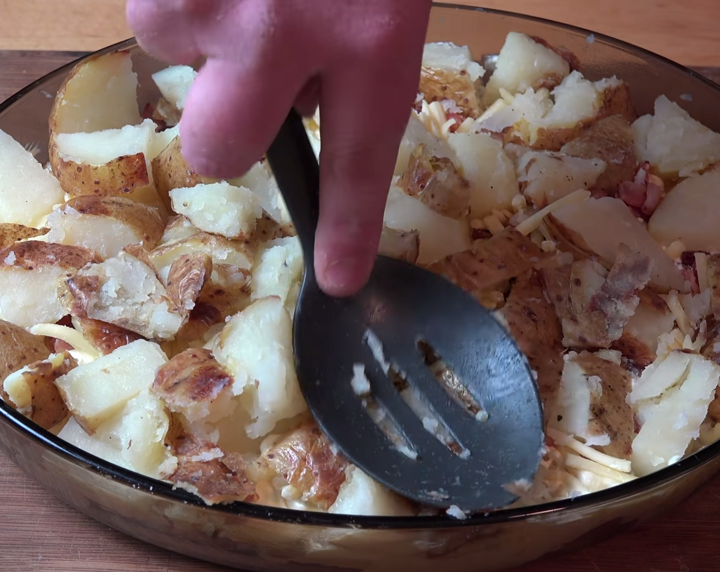 step 11 Using the back of a cooking spoon, give the potatoes a squish down. This helps to make sure that everything will be nicely compacted and fit properly.