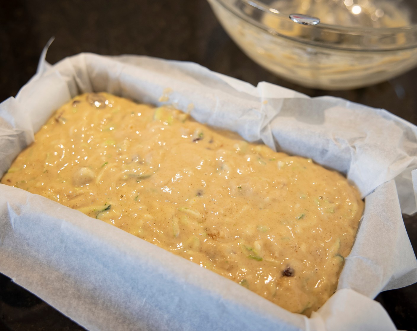 step 4 Pour the batter into the prepared loaf pan and bake for about 45-50 minutes, or until the top is set and a toothpick comes out clean or with a few moist crumbs but no batter. To help prevent excessive browning, loosely drape a piece of foil over the cake in the last 10 minutes of baking.