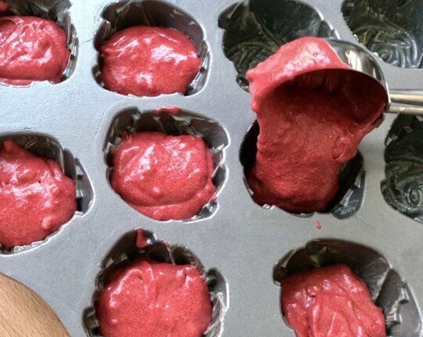 step 10 Using an ice-cream scoop, quickly spoon and divide batter evenly into the greased pan. Tap to remove excess air in the pan.