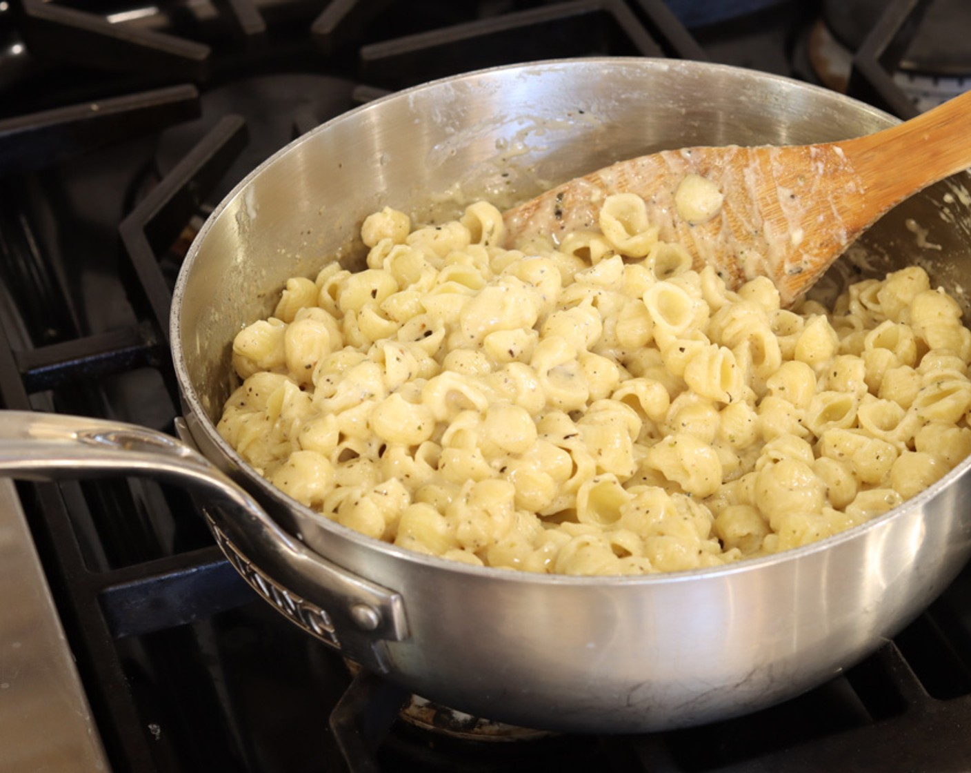 step 6 Add the cooked pasta to the cheese mixture and gently stir to completely coat pasta with sauce.