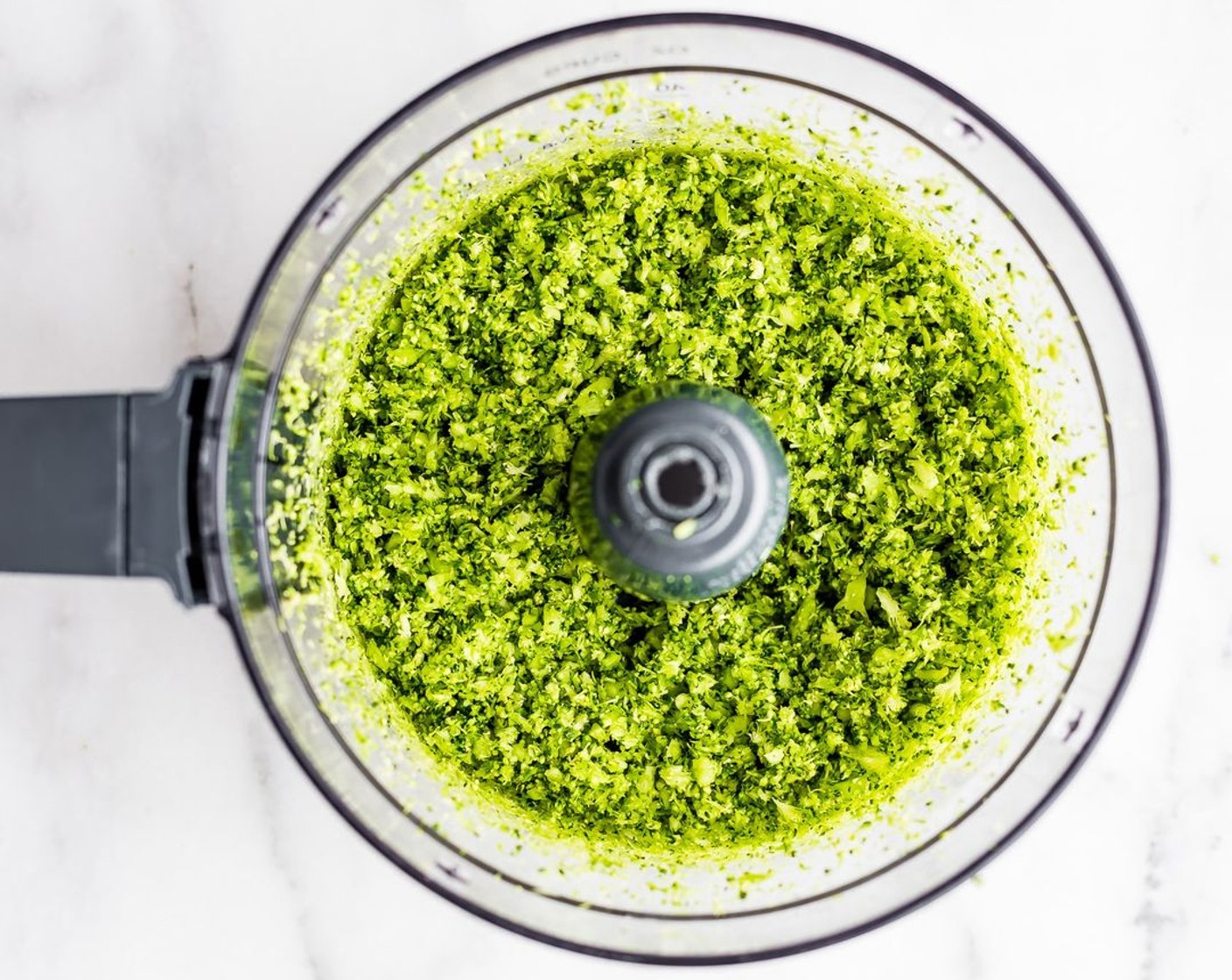 step 6 Cut your Broccoli (1 head) head into 3 to 4 parts. Place each into blender or food processor until all is "riced" texture.