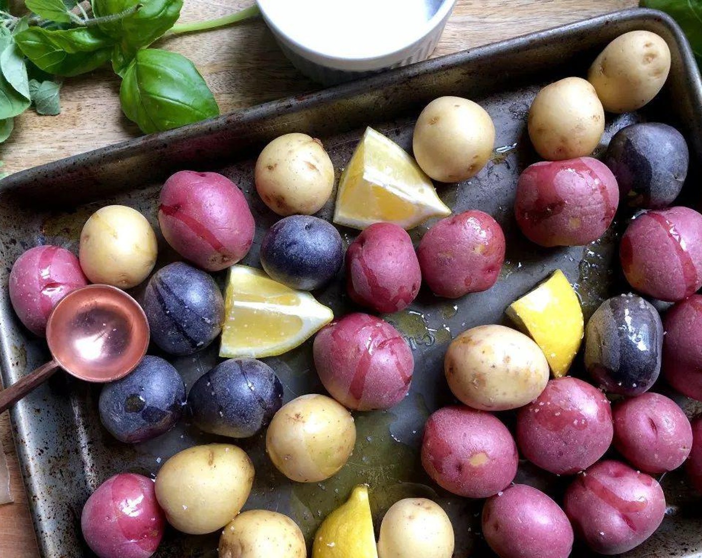 step 2 On a large baking sheet, toss together the Baby Potatoes (2 lb), Lemon (1/2), Olive Oil (1 Tbsp), and a generous pinch of salt. Place in the oven and roast for 20 minutes or until the potatoes are fork tender.
