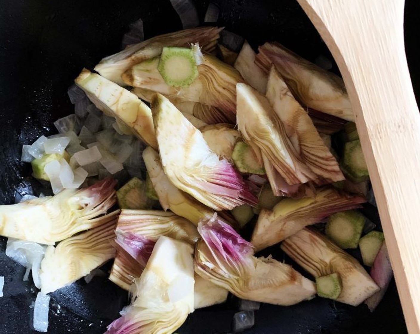 step 4 Once the onion is ready, add the artichokes to the skillet, season with Salt (to taste) and Ground Black Pepper (to taste), add about 1/2 cup of water, bring to a simmer and cover with a lid until tender - about 30 minutes.