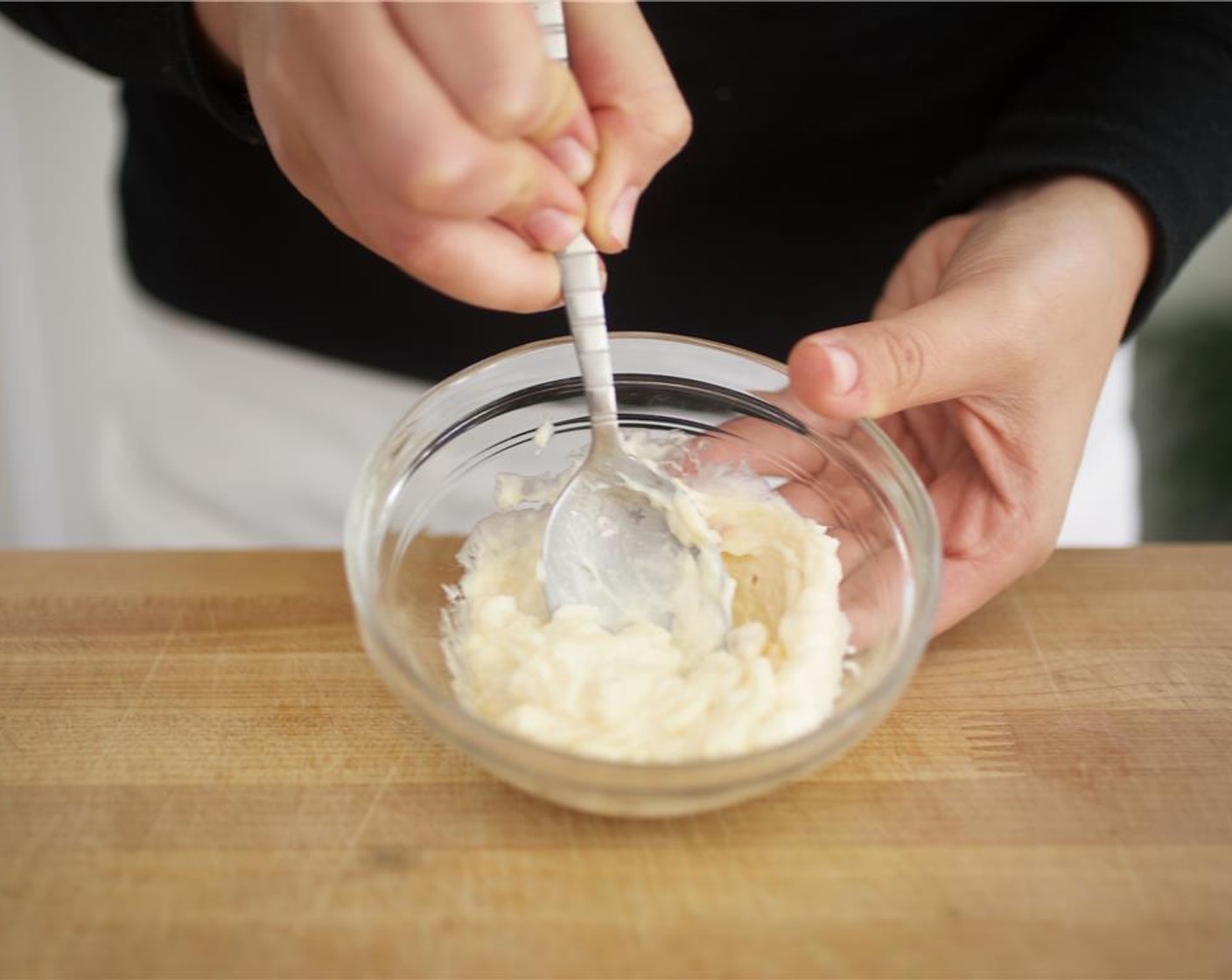 step 12 Using a spoon, smash roasted garlic and place into a small bowl. In the same bowl, add the Mayonnaise (2 Tbsp) and Extra-Virgin Olive Oil (1/2 Tbsp) Mix well and set aside.