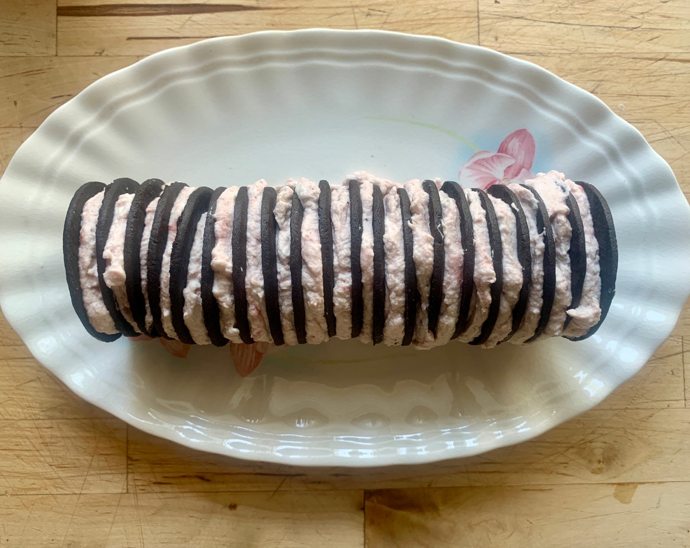 step 5 When you’ve done a few, lay them down on a plate edge side down and continue to spread the cream mixture onto wafers alternating wafer, cream, and so forth.