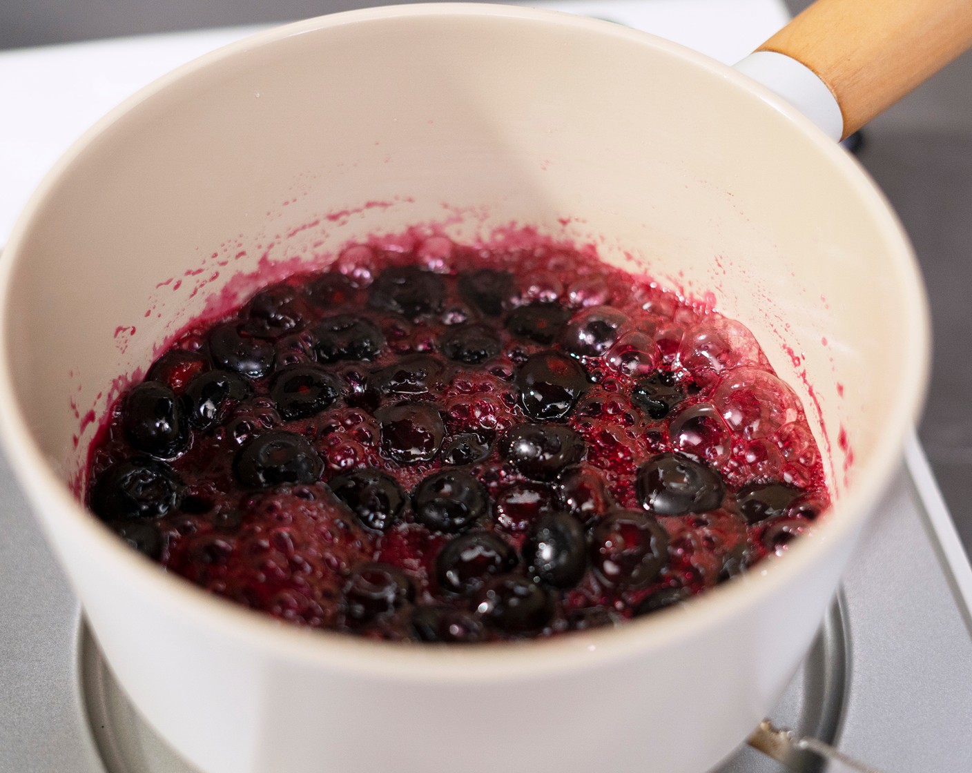 step 1 In a sauce pot, combine Fresh Blueberry (1 cup), Granulated Sugar (2 Tbsp), and 1/2 Tbsp of Lemon (1) together. Bring to a simmer and cook for 10 minutes until the sugar has dissolved and thickened. Stir often to ensure it doesn't burn along the side of the pot.