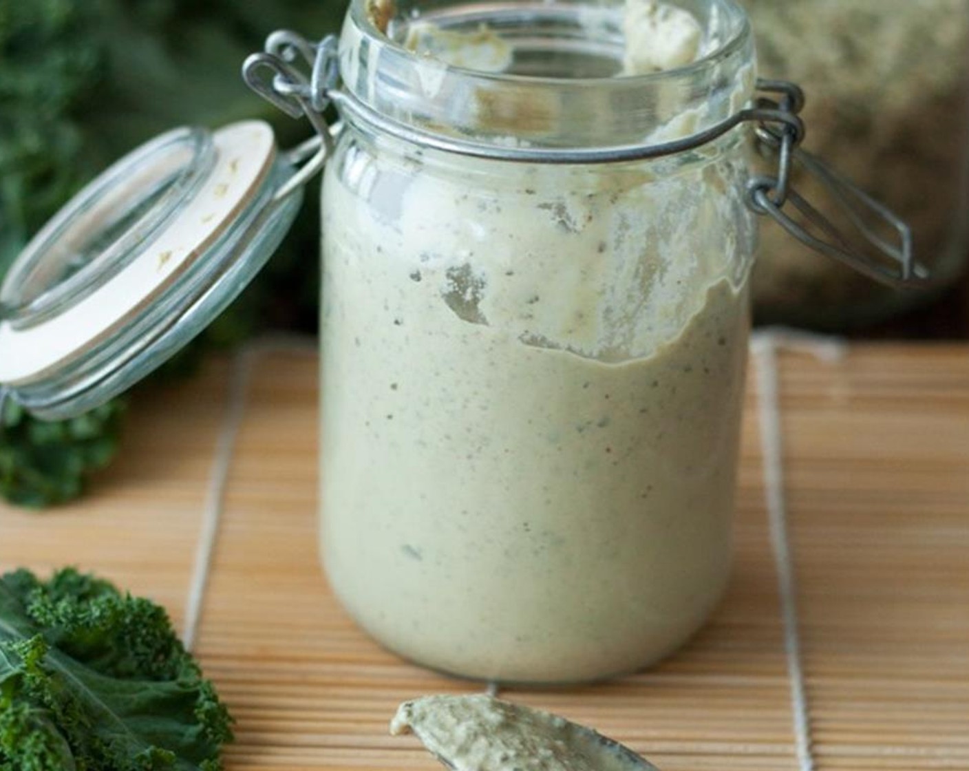 step 2 Once you have a well blended cashew cream, add water, Extra-Virgin Olive Oil (1 Tbsp), Nutritional Yeast (1 Tbsp), Lemon (1/2), Dijon Mustard (1 tsp), Capers (1 1/2 Tbsp), Garlic (1 clove), Tamari Soy Sauce (1 tsp), Kelp Granules (1 tsp), Salt (to taste), and Ground Black Pepper (to taste) to the blender. Blend until very well combined and smooth.