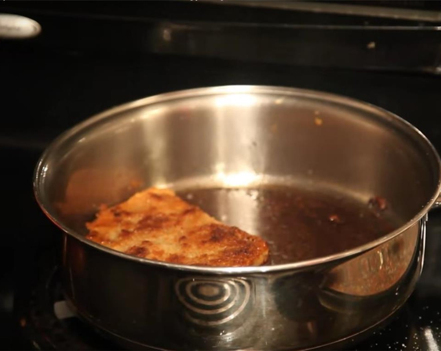 step 12 In a large, heavy-bottomed frying pan, heat half an inch to an inch of Coconut Oil (as needed). There should be enough oil to cover the cutlets completely.