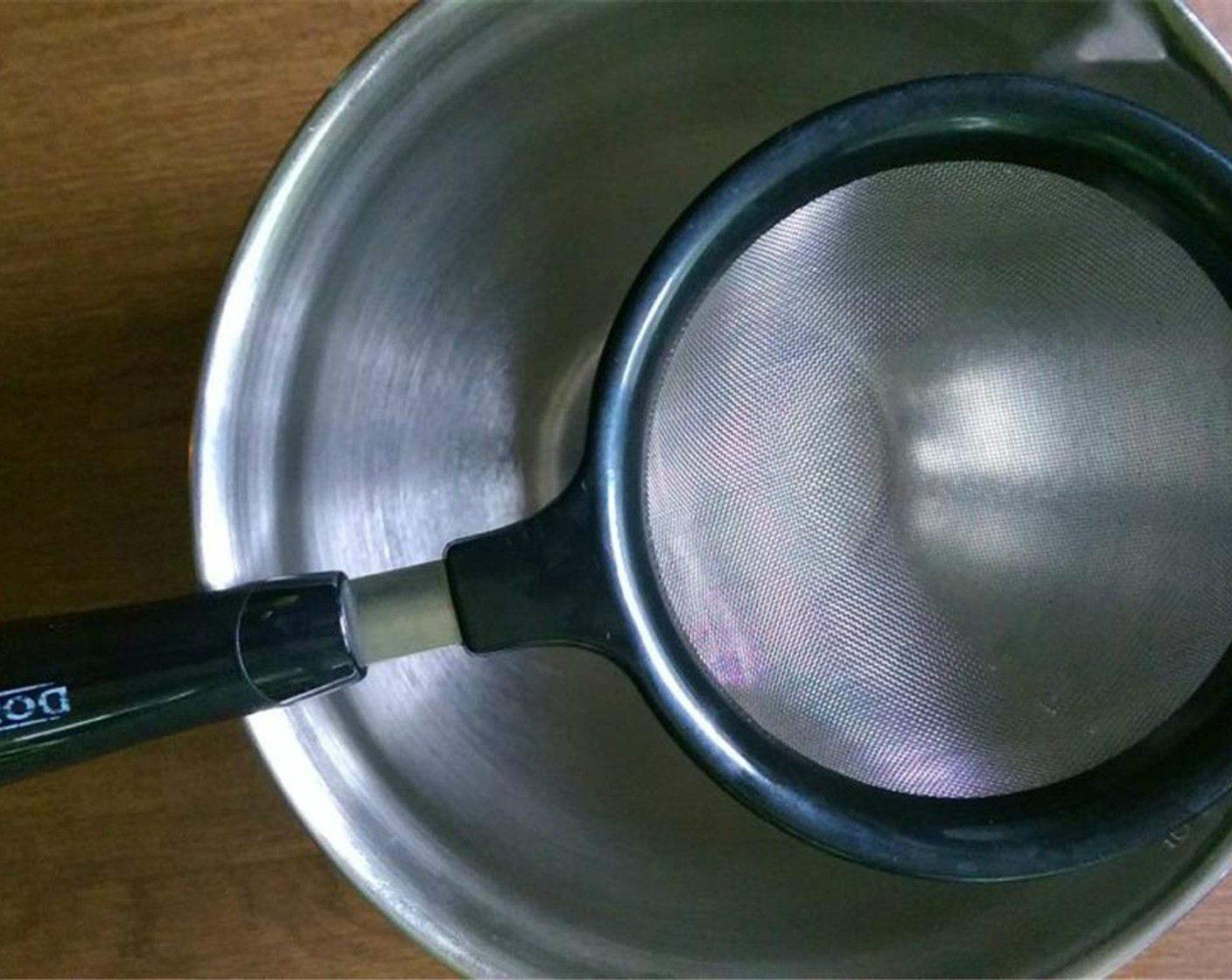 step 7 Place a strainer over a heat proof bowl.