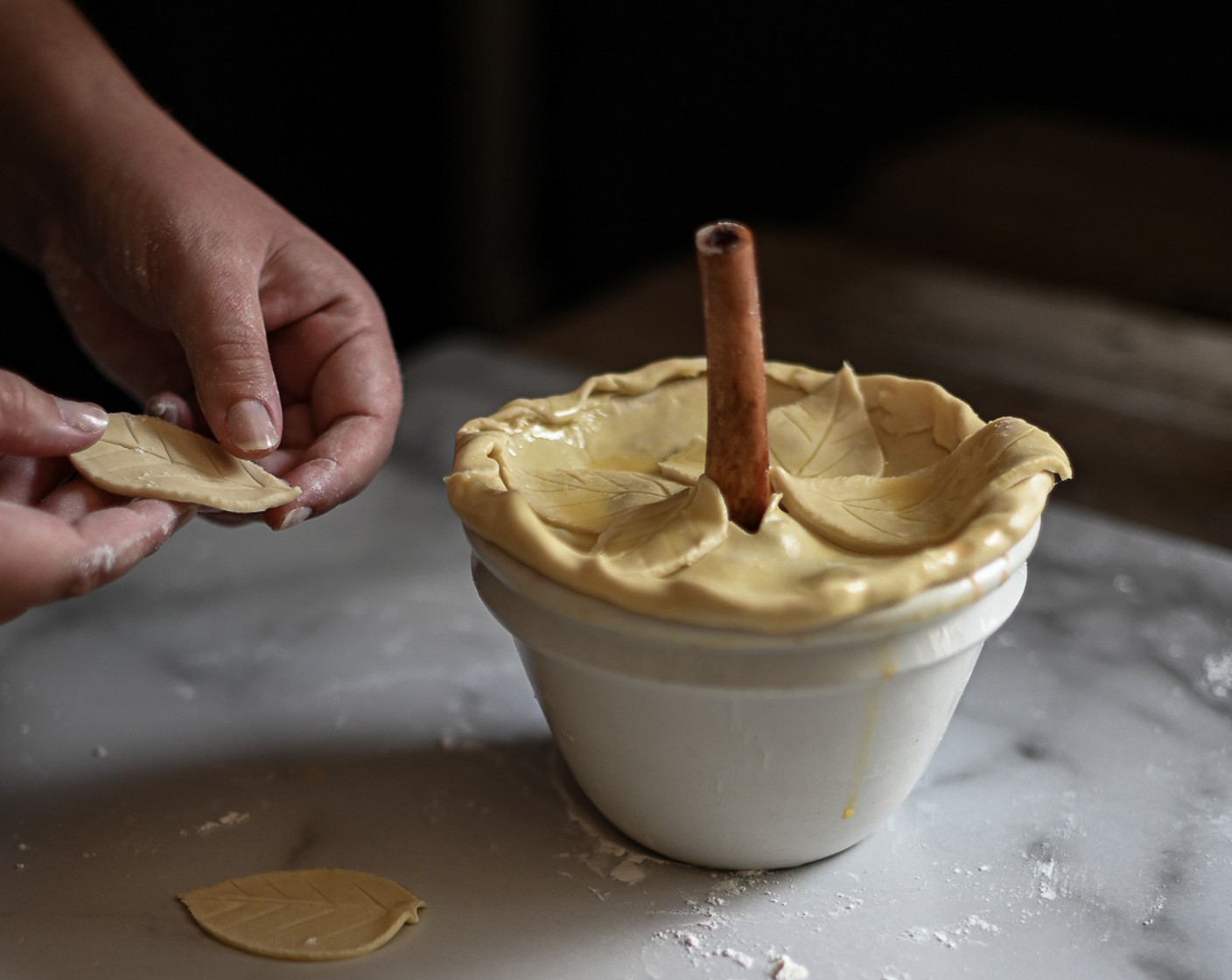 step 11 Carefully drape the pastry over each pie, slicing off any excess around the edges. Crimp in the cut edges of the pastry and roll out any leftover scraps to decorate the pies with.