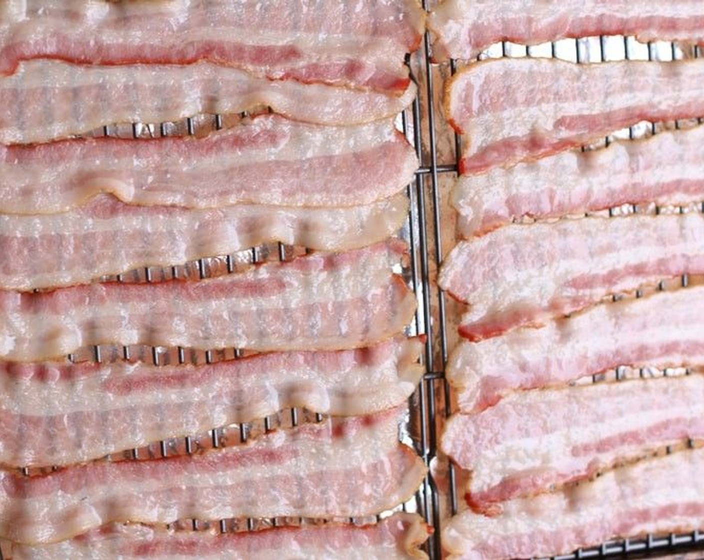 step 2 Arrange Applewood Smoked Bacon (1 lb) in a single layer on the rack. Bake for 12 minutes.