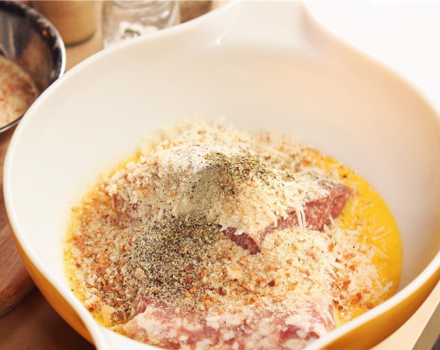 step 1 In a large bowl, combine Ground Beef (1 lb), Ground Pork (1 lb), Breadcrumbs (1 1/2 cups), Eggs (4), Parmesan Cheese (1/2 cup), McCormick® Garlic Powder (1/2 Tbsp), Ground Black Pepper (1 tsp), Salt (3/4 tsp), and Dried Oregano (1/2 tsp). Mix well, using your fingers or a fork.