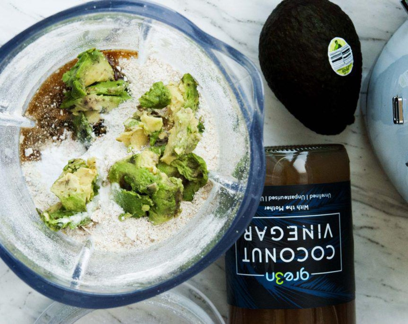 step 1 Place Oat Flour (1 cup), Avocado (1/2), Coconut Vinegar (1 Tbsp), Baking Powder (1/4 tsp), Maple Syrup (1 Tbsp), Vanilla Extract (1/4 tsp), Salt (1 pinch), Matcha Powder (1/4 tsp), and Non-Dairy Milk (1/2 cup) into your blender.