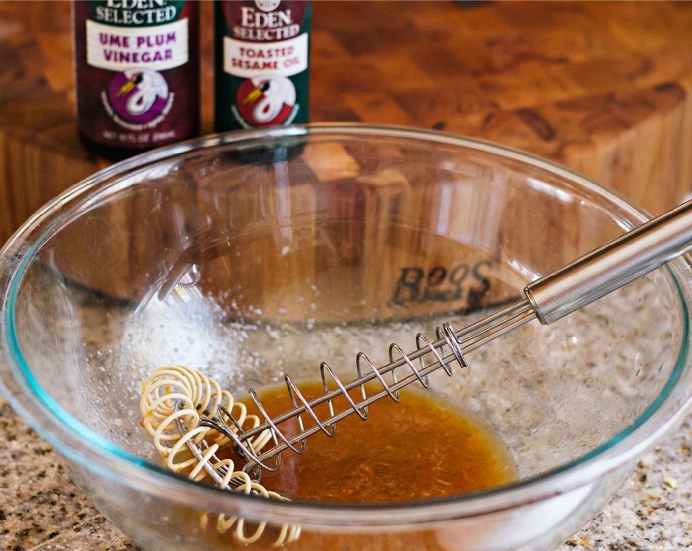step 1 In a large bowl, thoroughly whisk the Ume Plum Vinegar (3 Tbsp), juice and zest of the Lime (1), Fresh Ginger (1 tsp), and Toasted Sesame Oil (1/4 cup).