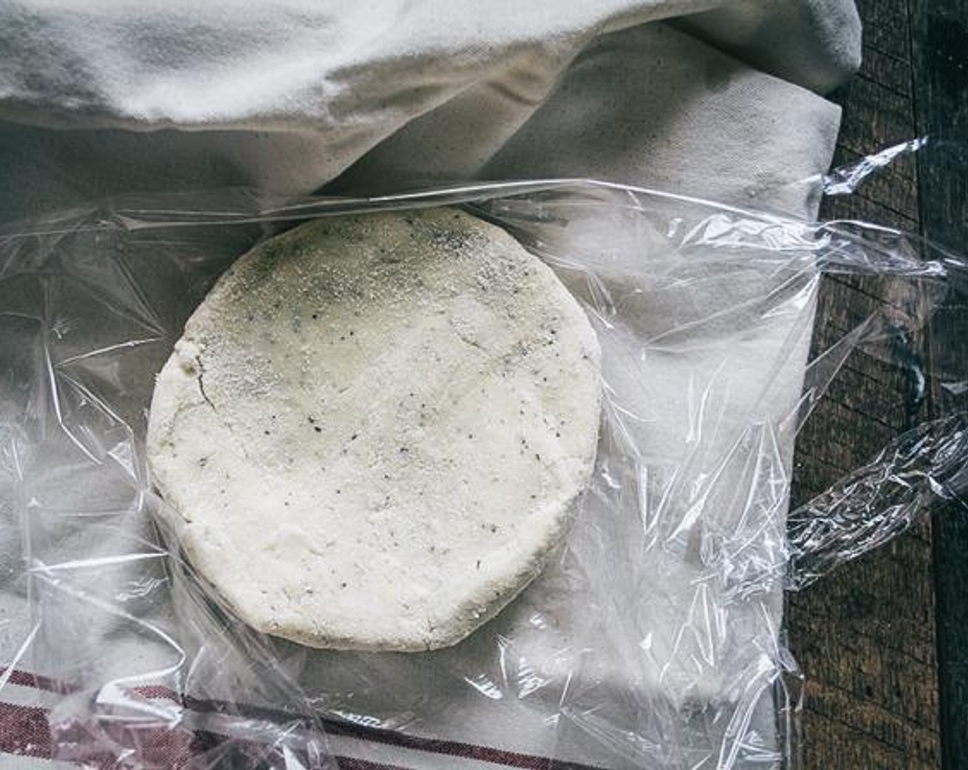 step 5 Flour a clean dry surface, using Gluten-Free All-Purpose Flour (to taste) then turn the mixture out and use your hands to form a 2 inch round, flat form. Wrap the dough in plastic wrap and put in refrigerator for 20-30 minutes (or longer).