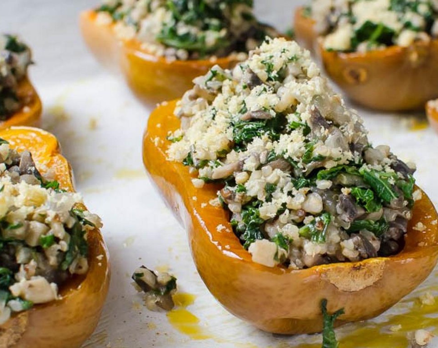 step 10 When the squash is done, fill the cavities with the stuffing and sprinkle with breadcrumbs and bake for an additional 10 minutes. If the breadcrumbs need additional browning, turn on the broiler and cook just until the breadcrumbs start to brown, about a minute or two.