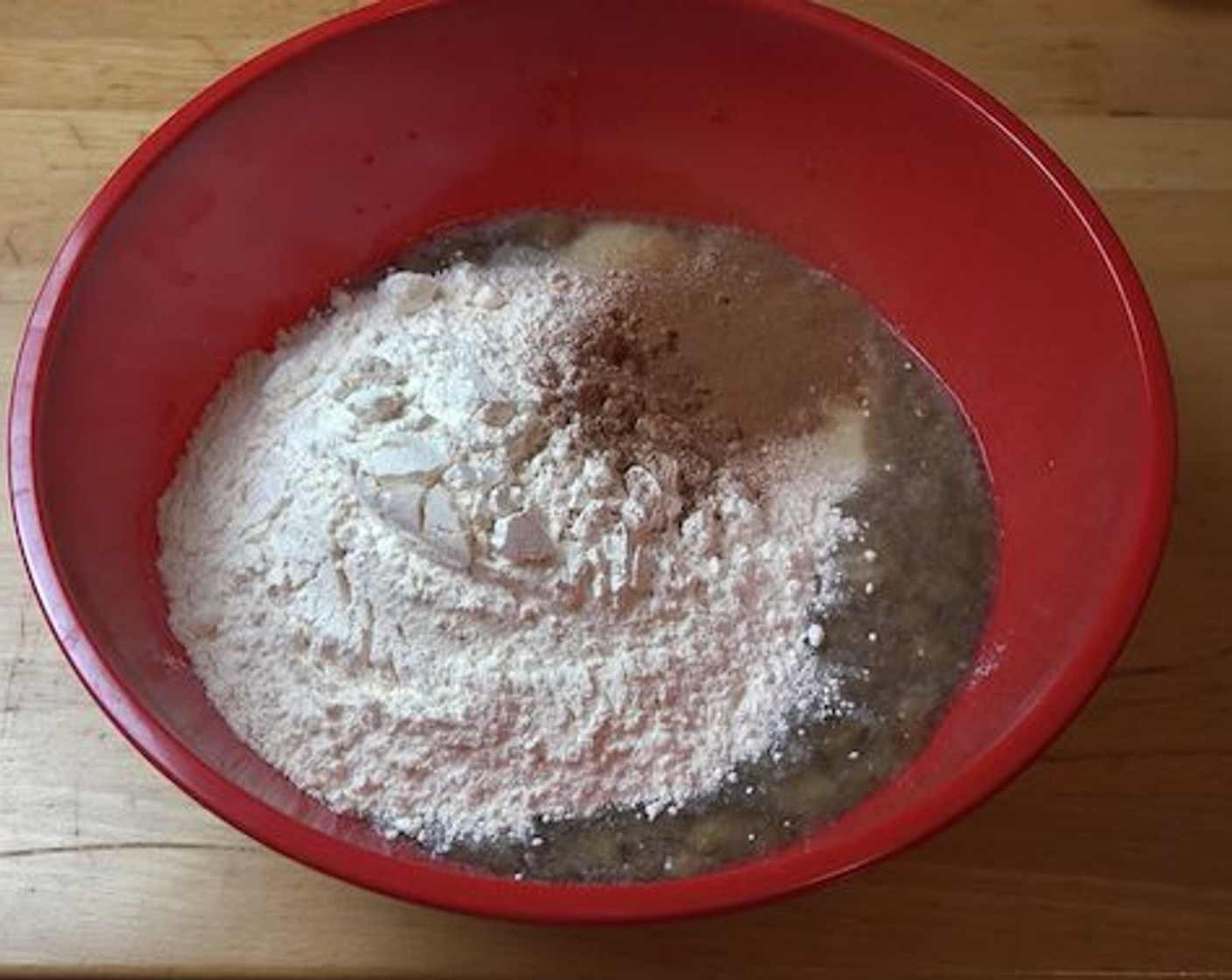 step 3 Next, add in La Lechera® Sweetened Condensed Milk (1 can), Self-Rising Flour (2 1/2 cups) and Ground Cinnamon (1 tsp). Give all the ingredients a good mix until just combined.