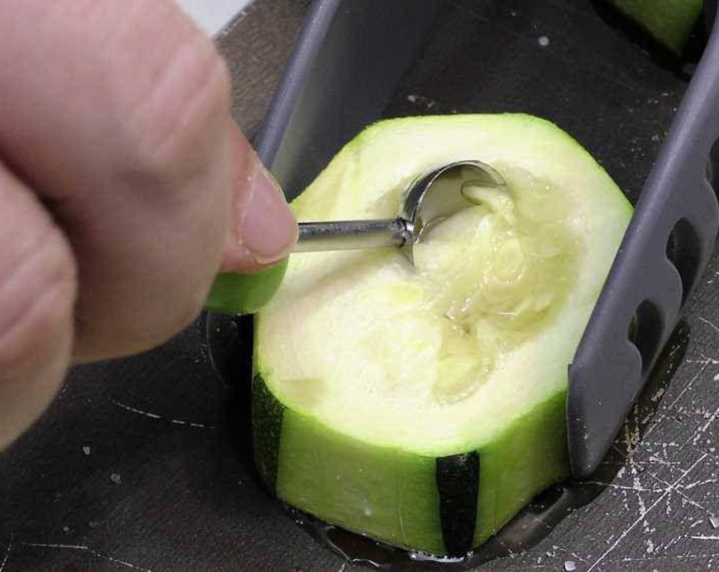 step 4 Remove the tray and carefully remove the center of the squash rounds with a small spoon.