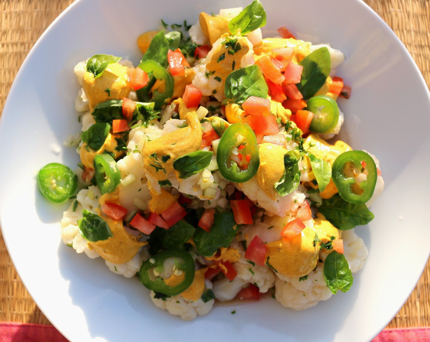 step 7 Sprinkle with Fresh Basil Leaves (12) and Jalapeño Peppers (2). Put the curry sauce in dollops over the dish.